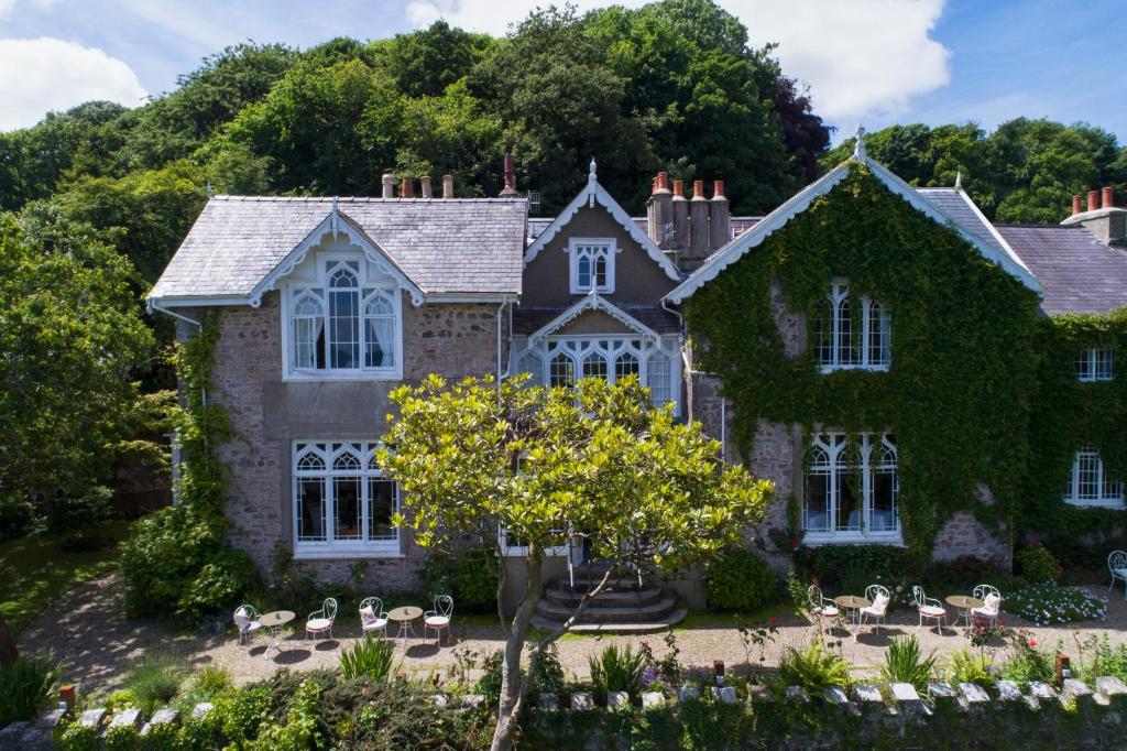 Introduction:  Planning a trip to Wales? Look no further! This article presents a carefully curated list of the top 10 hotels and inns across Wales. From breathtaking views to exceptional service, these accommodations guarantee an unforgettable experience. Let's dive into the mesmerizing world of Welsh hospitality.  The Lake Country House Hotel & Spa, Powys: Nestled within 50 acres of stunning parkland, The Lake Country House Hotel & Spa offers a tranquil retreat. Its elegant rooms, equipped with modern amenities, overlook the enchanting Lake Clywedog. Indulge in rejuvenating spa treatments, enjoy fine dining at the award-winning restaurant, and explore the scenic beauty of the Brecon Beacons National Park.  St. David's Hotel, Cardiff: Perched on the picturesque Cardiff Bay, St. David's Hotel combines contemporary luxury with breathtaking waterfront views. The stylish rooms, renowned spa, and exceptional dining options make this hotel an ideal choice for travelers seeking an urban escape. With easy access to the vibrant city center, guests can explore Cardiff's rich cultural offerings.  The Grove Narberth, Pembrokeshire: Situated amidst the rolling hills of Pembrokeshire, The Grove Narberth boasts a blend of elegance and comfort. Each room is uniquely designed, exuding charm and sophistication. Guests can savor delectable dishes crafted from locally sourced ingredients at the award-winning restaurant. The hotel's proximity to Pembrokeshire Coast National Park makes it perfect for nature enthusiasts.  Penally Abbey, Tenby: A former 18th-century abbey, Penally Abbey offers a captivating stay near the coastal town of Tenby. This boutique hotel features individually designed rooms, blending classic elegance with modern comforts. Guests can explore the scenic coastline, enjoy sumptuous dining experiences, and relish the hotel's warm hospitality.  Llangoed Hall, Brecon: Steeped in history and surrounded by breathtaking Welsh countryside, Llangoed Hall is an enchanting country house hotel. The elegantly furnished rooms, adorned with period features, provide a luxurious retreat. Guests can explore the hotel's extensive gardens, indulge in gourmet dining, and take advantage of the proximity to the Brecon Beacons National Park.  Tyddyn Llan Restaurant with Rooms Denbighshire: Nestled in the heart of the Denbighshire countryside, Tyddyn Llan offers a delightful blend of fine dining and luxurious accommodation. With only six individually styled rooms, the hotel provides an intimate and exclusive experience. Guests can savor the Michelin-starred cuisine, explore the surrounding landscapes, and unwind in this idyllic retreat.  Bodysgallen Hall & Spa Conwy: Located in a magnificent Grade I listed country house, Bodysgallen Hall & Spa offers a truly luxurious escape. The hotel's opulent rooms, stunning gardens, and rejuvenating spa make it a haven of tranquility. Guests can explore the historic town of Conwy, soak in the breathtaking views of Snowdonia National Park, and indulge in gourmet delights.  The Falcondale Hotel & Restaurant Lampeter: Nestled in the beautiful Teifi Valley, The Falcondale Hotel & Restaurant offers a peaceful countryside getaway. The hotel's elegantly furnished rooms, charming gardens, and award-winning restaurant ensure a memorable stay. Guests can explore the nearby market town of Lampeter or venture into the picturesque landscapes of Ceredigion.  The Grove at Narberth Pembrokeshire: Tucked away in the heart of Pembrokeshire, The Grove at Narberth is a luxurious country house hotel. The individually designed rooms, tranquil gardens, and gourmet dining options create an enchanting ambiance. Guests can explore the Pembrokeshire Coast National Park, unwind in the hotel's spa, or simply enjoy the serenity of the surroundings.  Fairyhill, Gower: Set within 24 acres of stunning grounds on the Gower Peninsula, Fairyhill offers a truly enchanting experience. The hotel's beautifully appointed rooms, elegant interiors, and exquisite dining make it a hidden gem. Guests can explore the idyllic Gower coastline, unwind in the peaceful surroundings, and savor culinary delights crafted from locally sourced produce.  Conclusion:  Wales is home to a plethora of remarkable hotels and inns that combine breathtaking landscapes, warm hospitality, and exquisite amenities. From luxurious country house hotels to stylish waterfront retreats, these carefully selected accommodations provide a perfect base for exploring the beauty of Wales. Choose your favorite and embark on an unforgettable Welsh adventure!